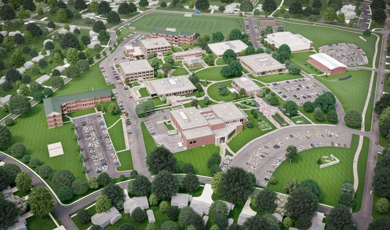 Aerial view of Avila University campus showing brick buildings, green lawns, parking lots, and athletic fields in Kansas City Missouri