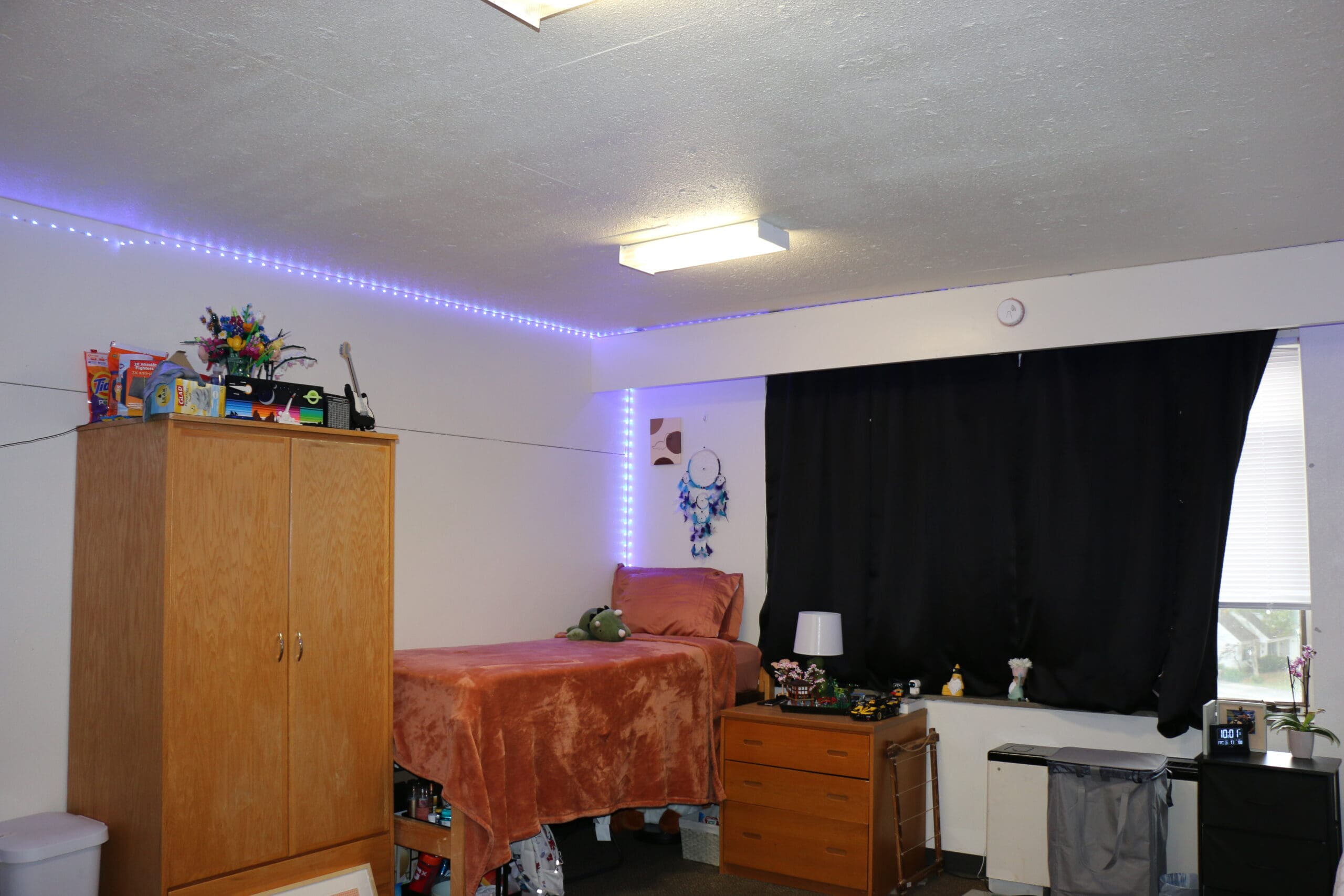 Student bedroom with computer desk and organized study setup