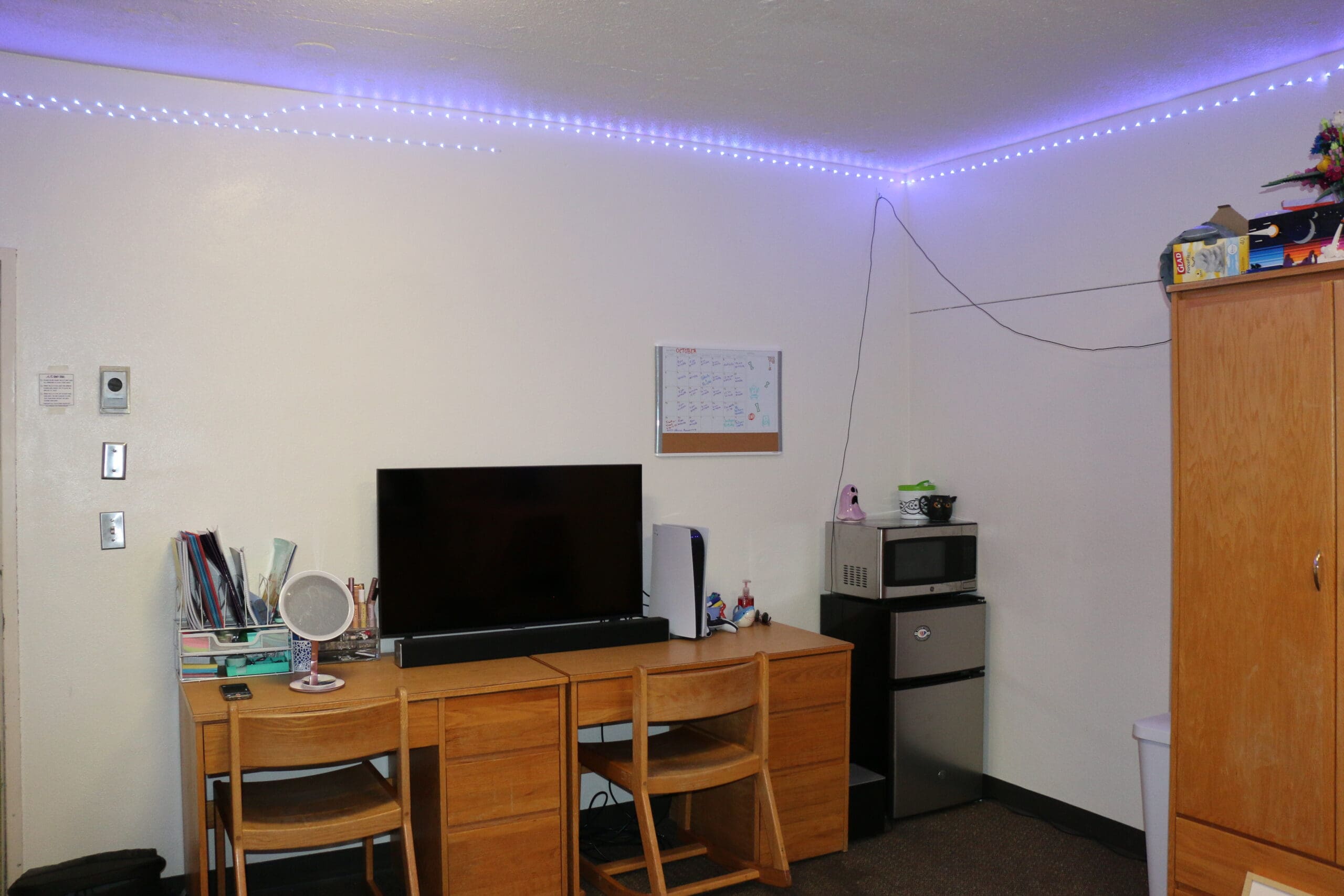 Student bedroom with computer desk and organized study setup