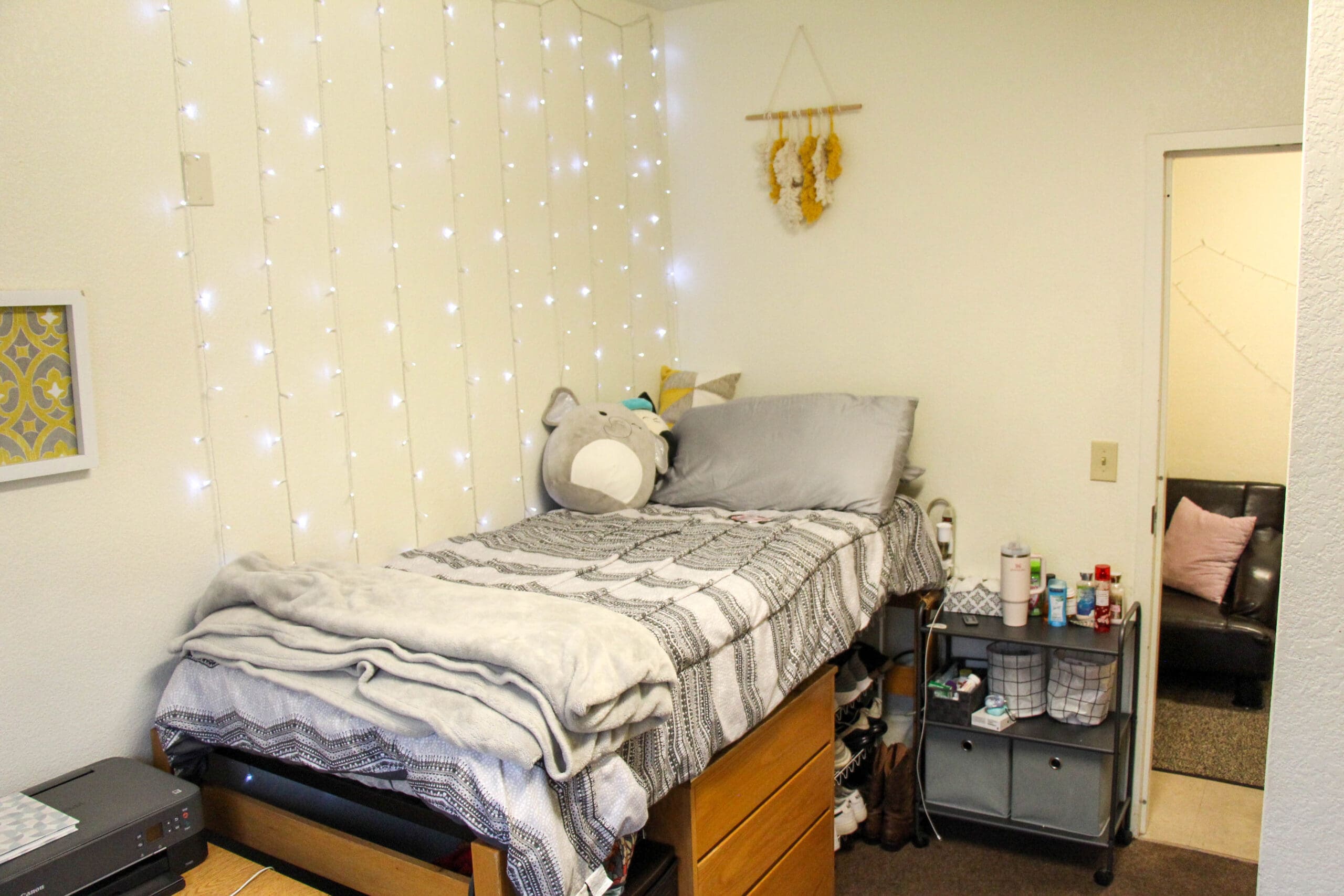 Wylie Hall suite bedroom with dresser and desk