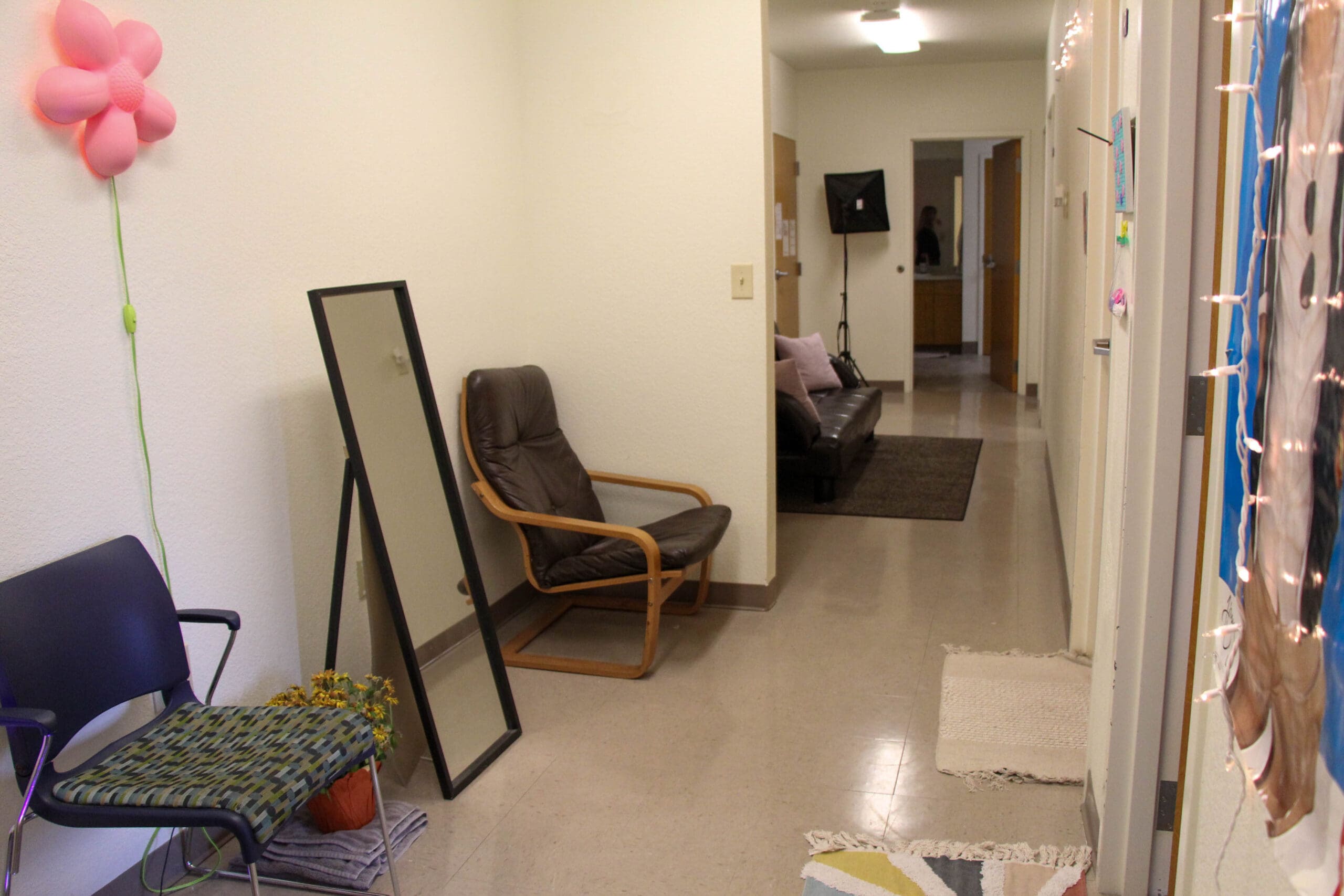 Wylie Hall suite bedroom with desk, chair, and organized living space