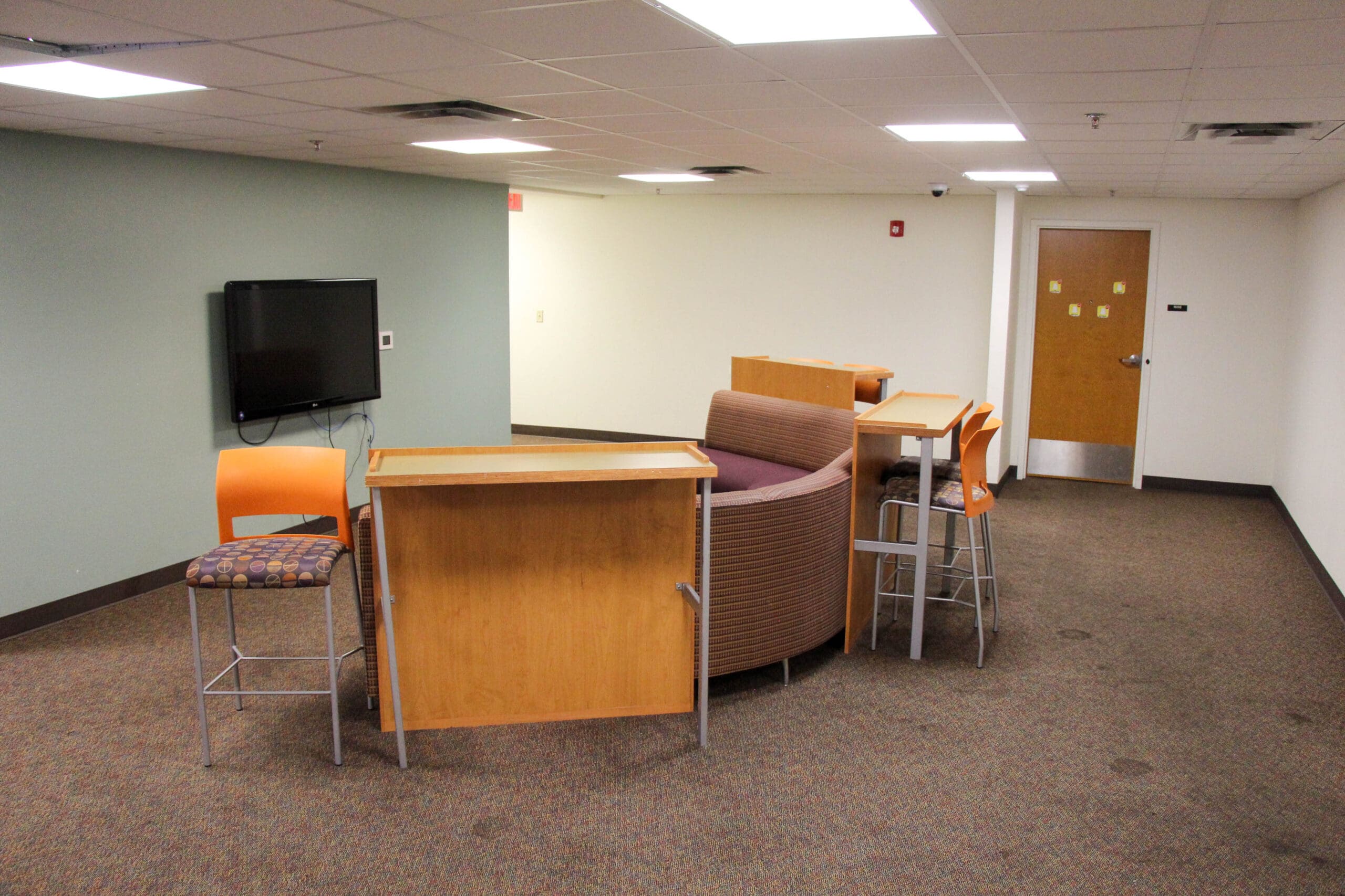 Wylie Hall floor common area with seating and workspace