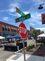18th and Vine Street intersection in Kansas City Missouri with a stop sign and historic district storefronts