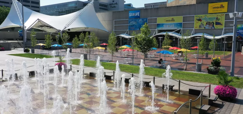 Outdoor fountain plaza at the Kansas City Power and Light District with the SEA LIFE aquarium in the background