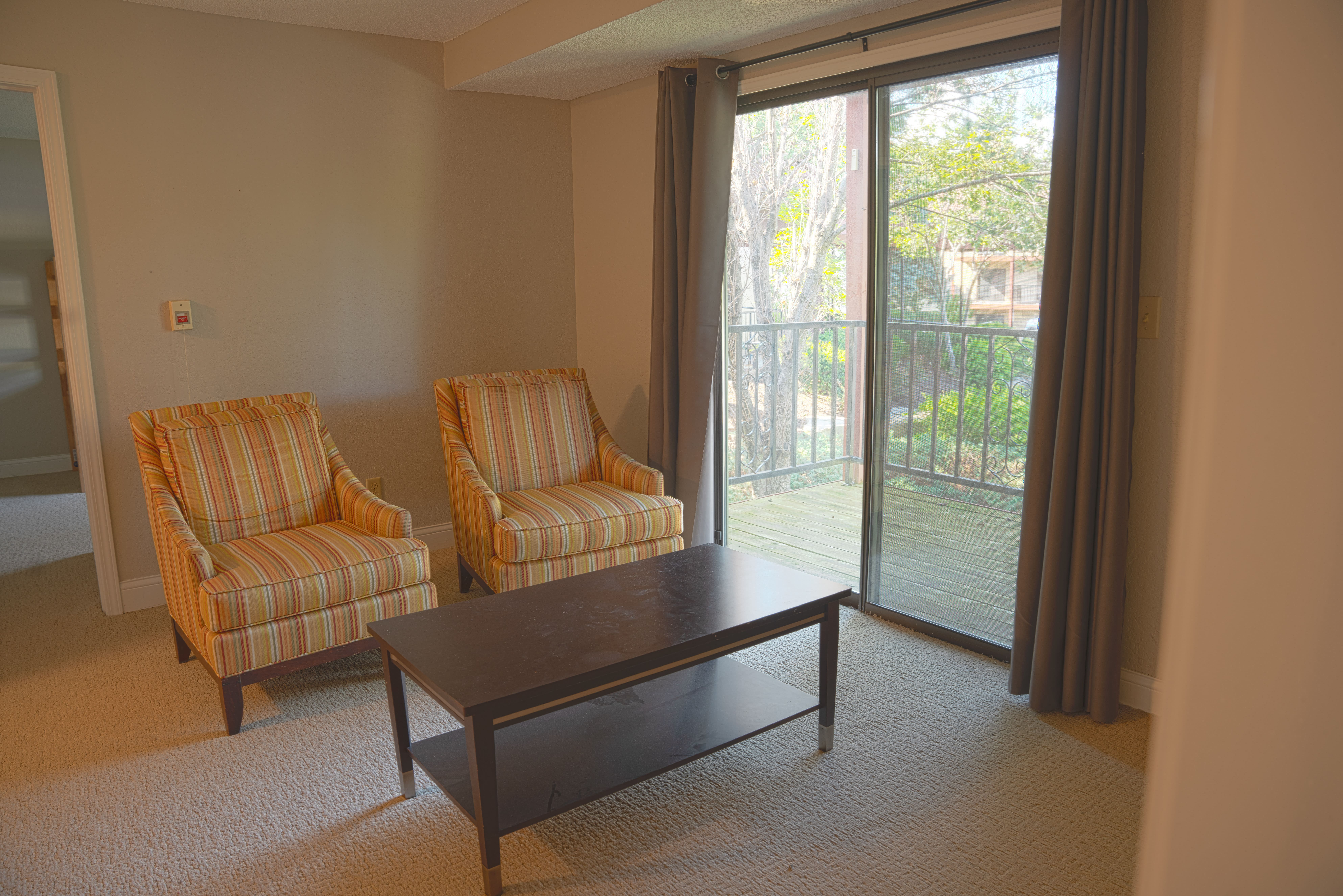 Campus residence hall room with neatly arranged furniture.